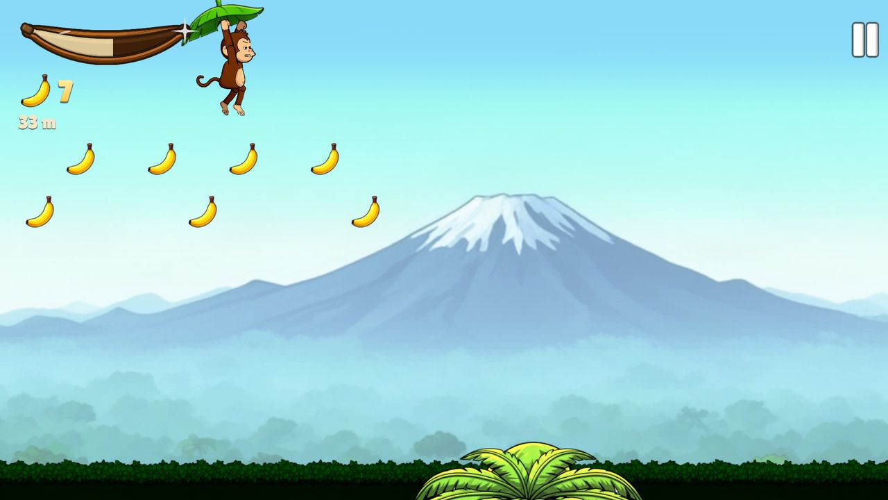 Captura de Turbo Monkey: el mono planea sobre las copas de los árboles con una montaña nevada al fondo